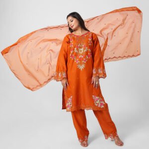 orange embroidered suit set, burnt orange cotton kurta pant dupatta, women’s festive kurta set, floral cutwork kurta, breathable summer ethnic wear, straight fit kurta set, embellished sheer dupatta outfit, bright occasion wear suit.