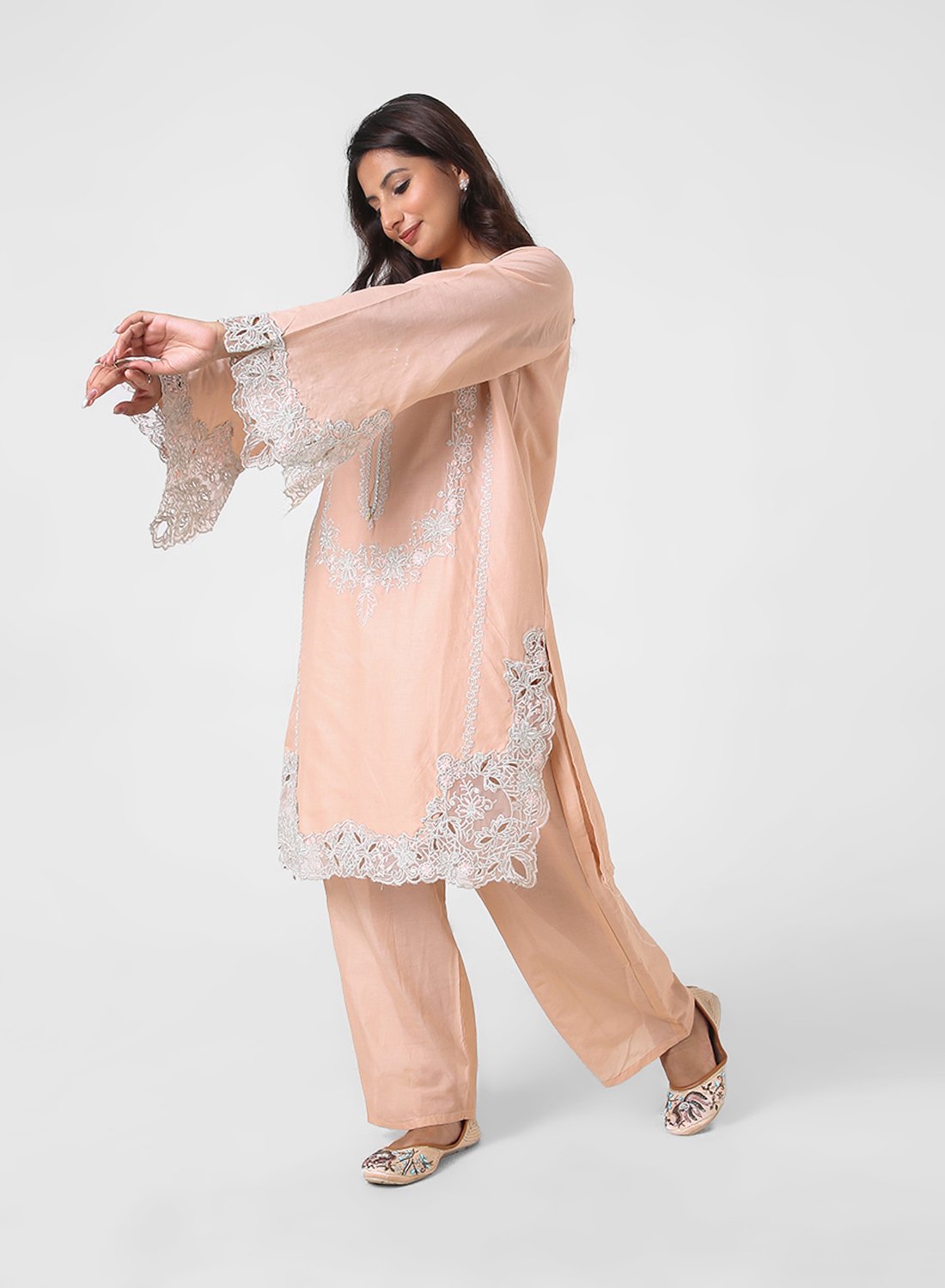 peach lace kurta set, embroidered cotton kurta pants, women’s occasion wear suit, scalloped lace hem kurta, pastel festive outfit, straight fit kurta set, elegant ethnic set for women.