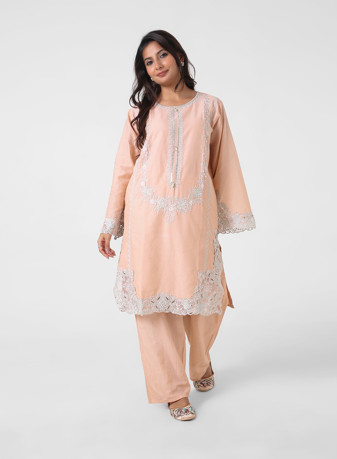 peach lace kurta set, embroidered cotton kurta pants, women’s occasion wear suit, scalloped lace hem kurta, pastel festive outfit, straight fit kurta set, elegant ethnic set for women.