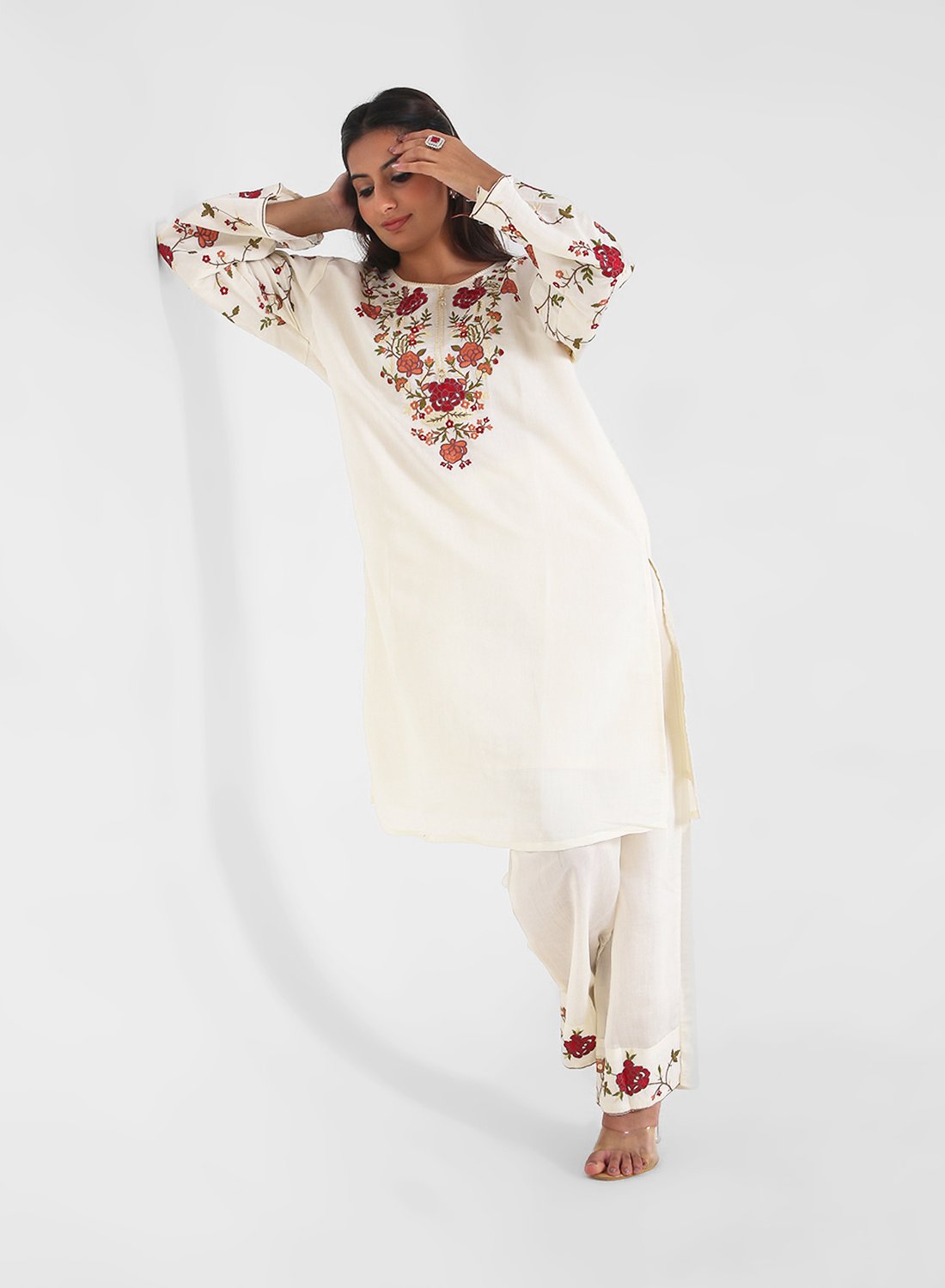 ivory floral embroidered kurta set, cotton kurta pants for women, multicolor threadwork kurta, breathable summer ethnic wear, straight fit kurta set, embroidered sleeve kurta, elegant daytime Indian suit.