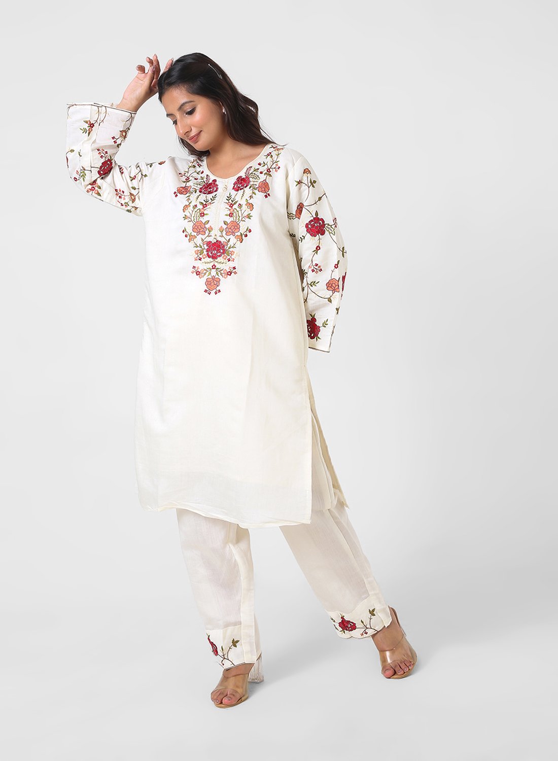 ivory floral embroidered kurta set, cotton kurta pants for women, multicolor threadwork kurta, breathable summer ethnic wear, straight fit kurta set, embroidered sleeve kurta, elegant daytime Indian suit.