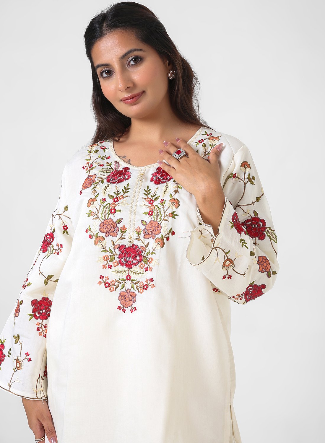 ivory floral embroidered kurta set, cotton kurta pants for women, multicolor threadwork kurta, breathable summer ethnic wear, straight fit kurta set, embroidered sleeve kurta, elegant daytime Indian suit.