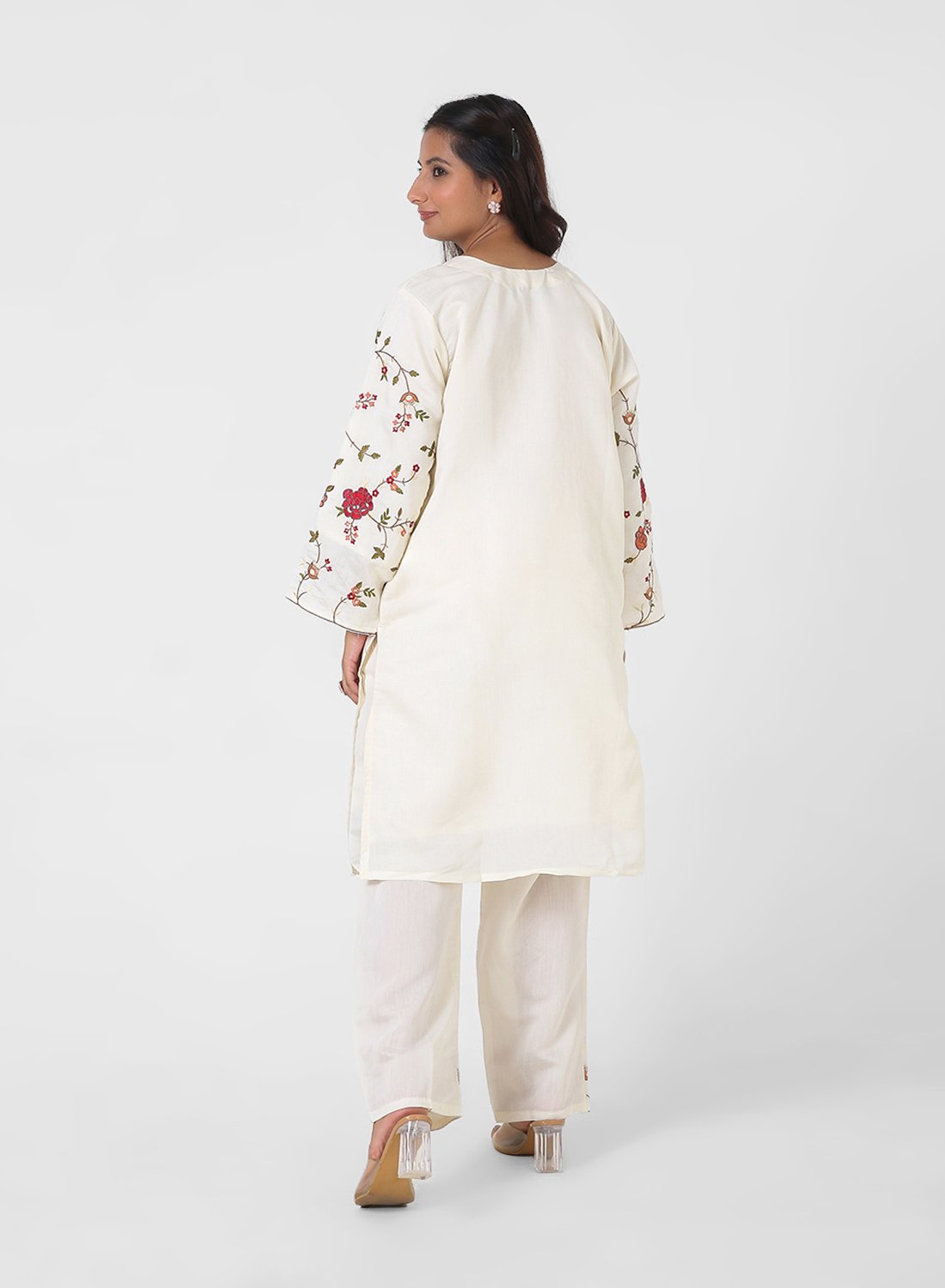 ivory floral embroidered kurta set, cotton kurta pants for women, multicolor threadwork kurta, breathable summer ethnic wear, straight fit kurta set, embroidered sleeve kurta, elegant daytime Indian suit.