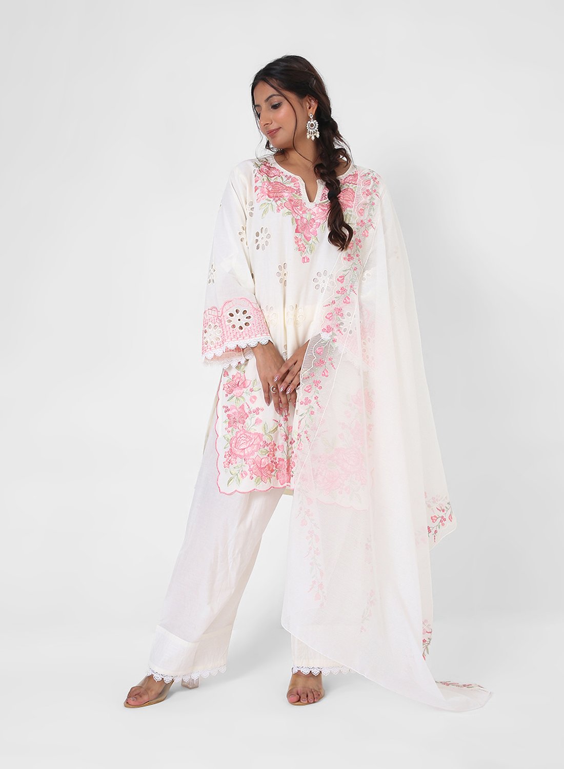 ivory embroidered suit set, cotton kurta pant dupatta, eyelet cutwork kurta, pink floral threadwork suit, breathable summer ethnic wear, straight fit kurta set, pastel festive outfit for women.